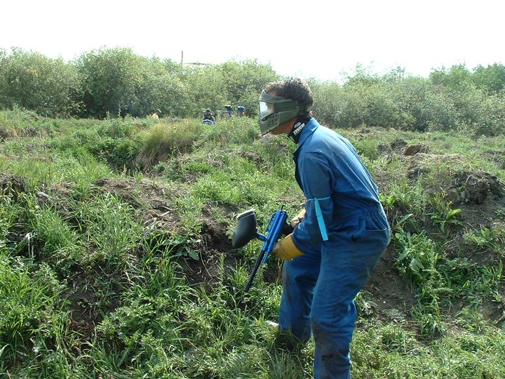 Rental coveralls and a mask, picking a way through the brush